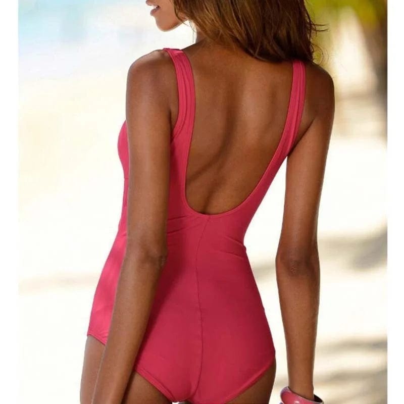 Maillot de bain une pièce bordeaux élégant pour femme, dos échancré parfait pour la plage.