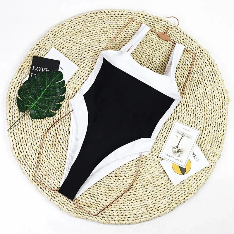Maillot de bain une pièce noir et blanc, élégant et chic pour femme, parfait pour l'été.