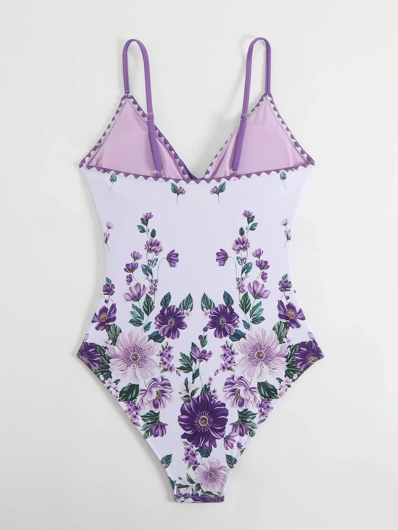 Maillot de bain une pièce femme à imprimé floral violet, élégant et tendance pour l'été.