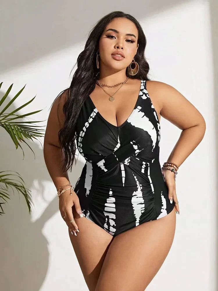 Maillot de bain une pièce femme avec motif géométrique noir et blanc, style moderne chic.