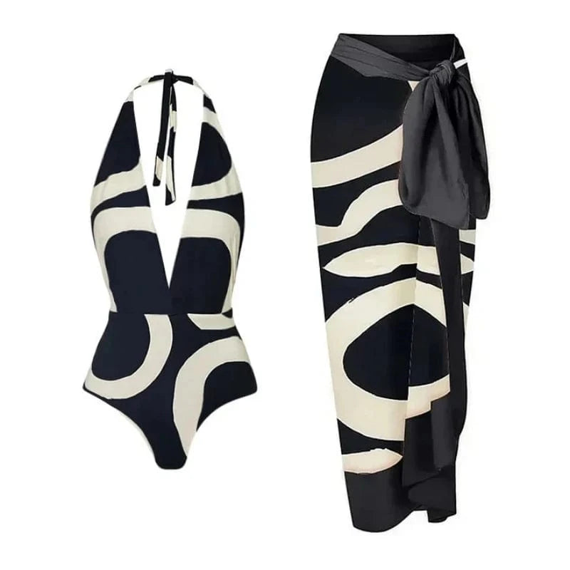 Maillot de bain une pièce femme avec motif graphique noir et blanc, élégant et moderne.