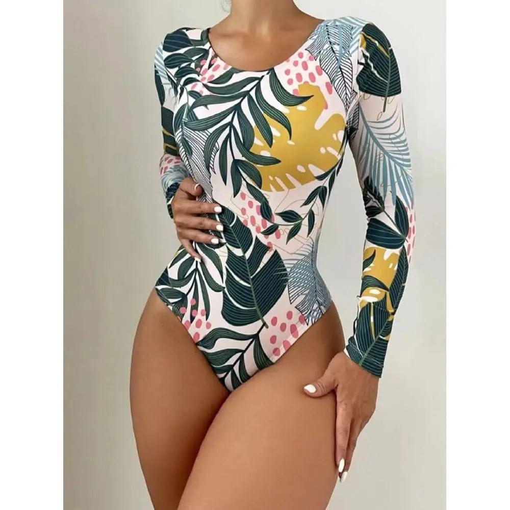 Maillot de bain une pièce femme à manches longues avec motif tropical coloré et élégant.