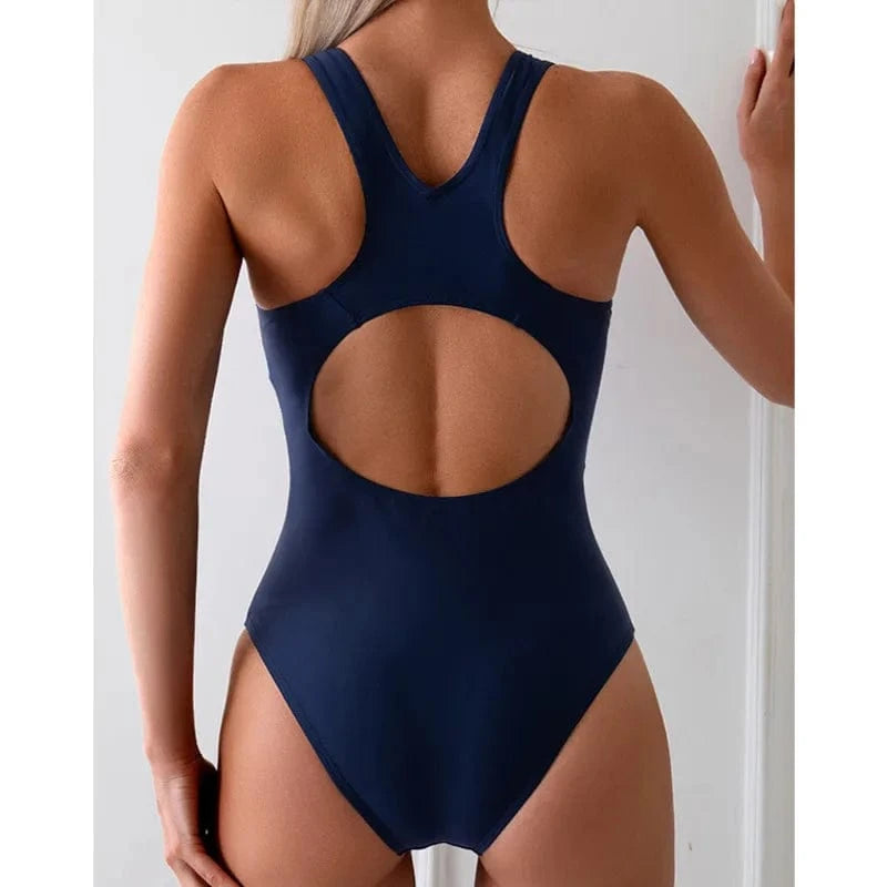 Maillot de bain femme 1 pièce bleu marine avec dos ouvert élégant pour un style moderne.