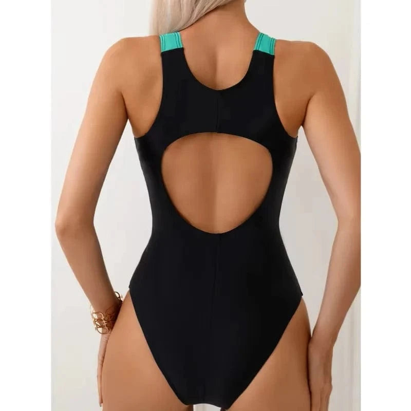Maillot de bain une pièce noir avec découpe élégante au dos et bretelles vertes tendance.