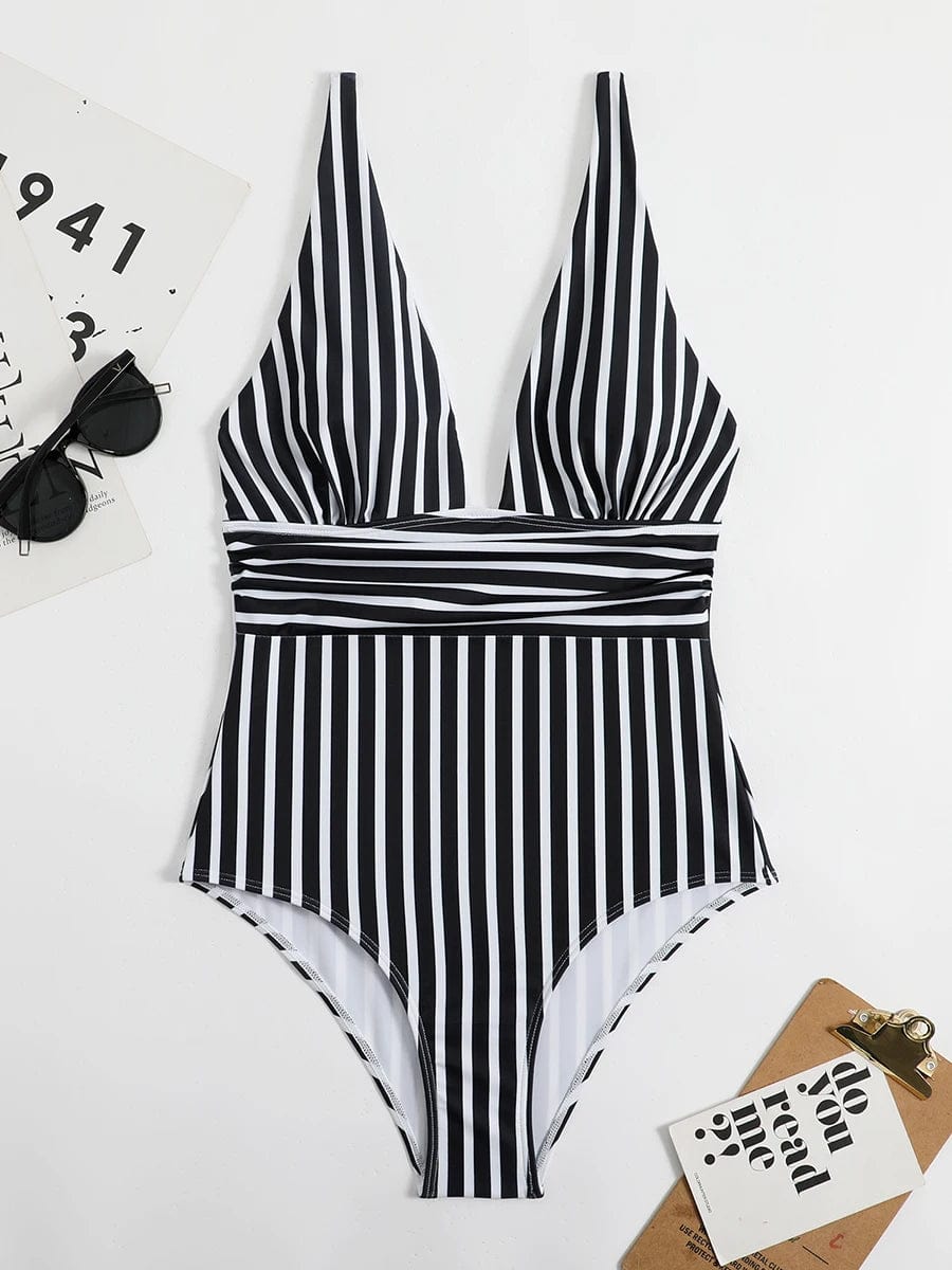 Maillot de bain une pièce femme noir et blanc rayé à col plongeant, élégant et moderne.