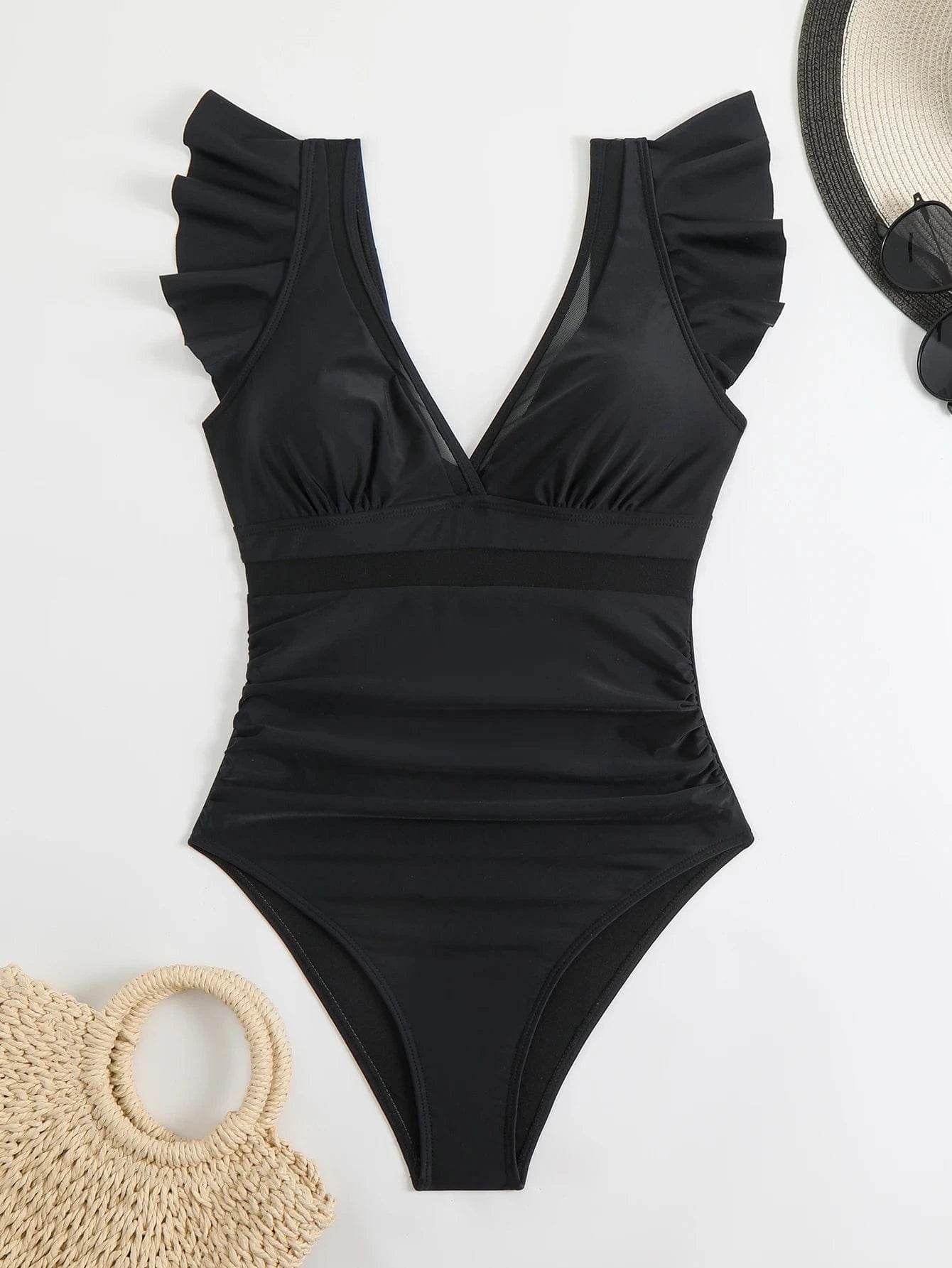 Maillot de bain une pièce noir élégant avec volants, parfait pour l'été et les vacances à la plage.