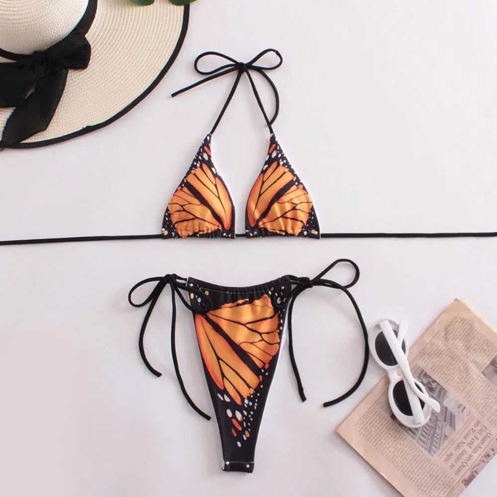 Maillot de bain femme bikini avec imprimé papillon aux motifs orange et noir, élégant et tendance.