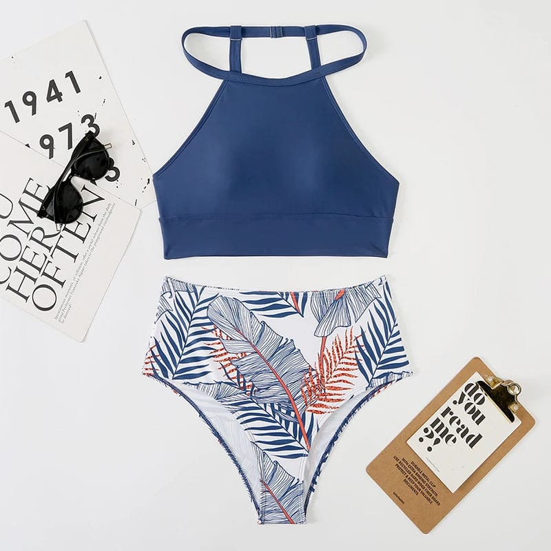 Maillot de bain femme deux pièces bleu marine à motifs tropicaux, taille haute élégante.