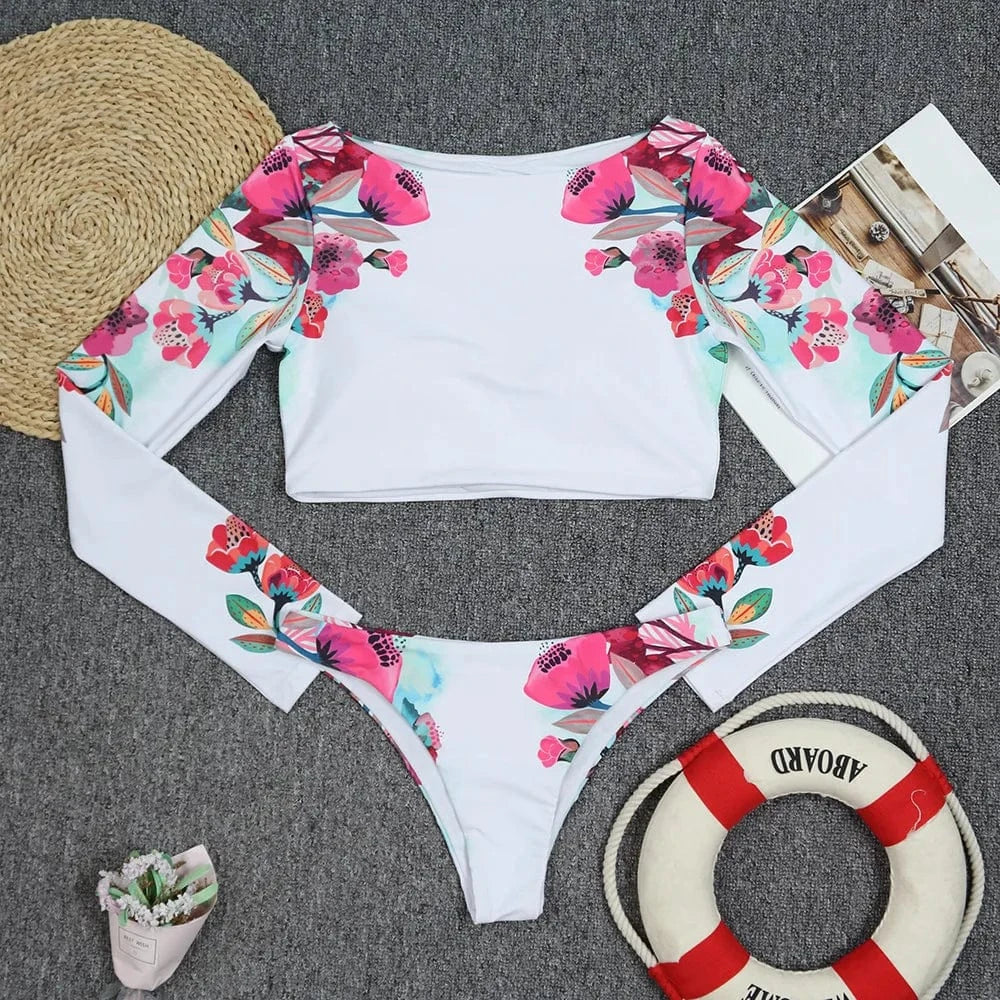 Maillot de bain élégant femme, motif floral coloré et manches longues pour un style unique.