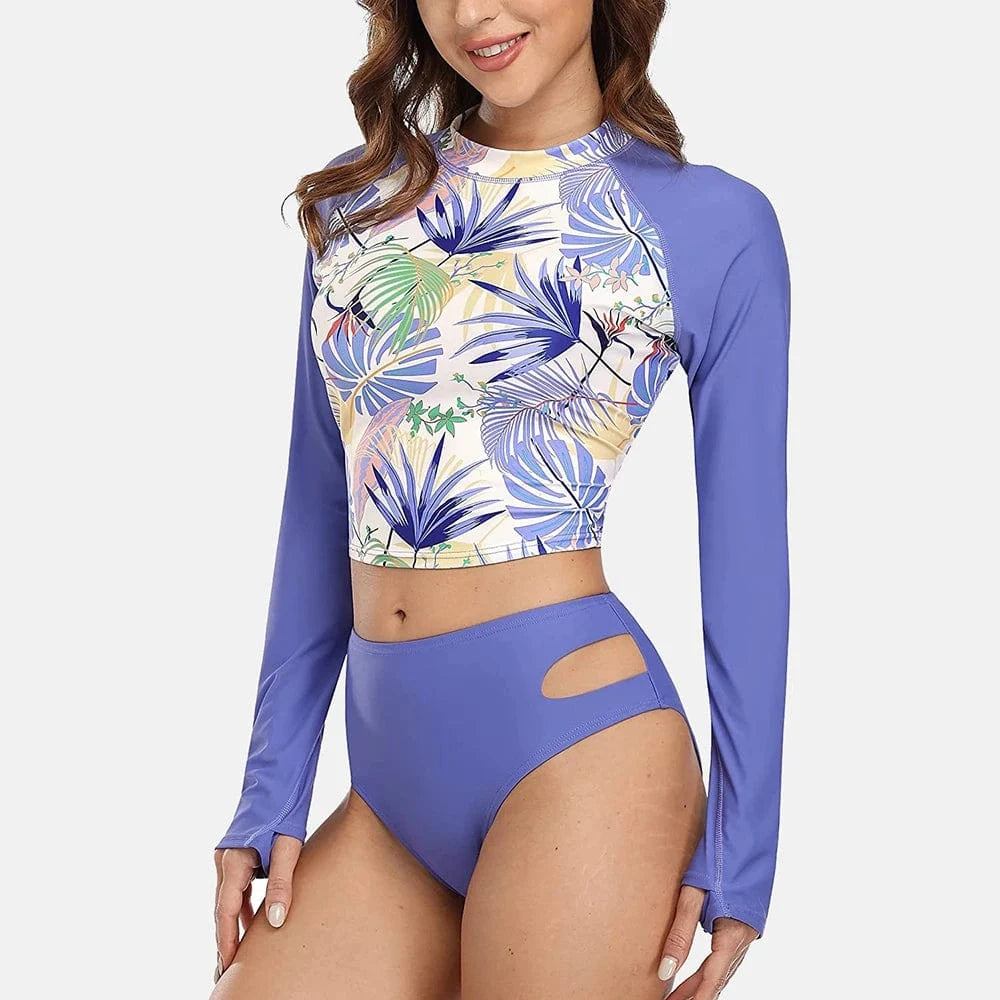 Maillot de bain femme manches longues violet avec imprimé floral tropical tendance.