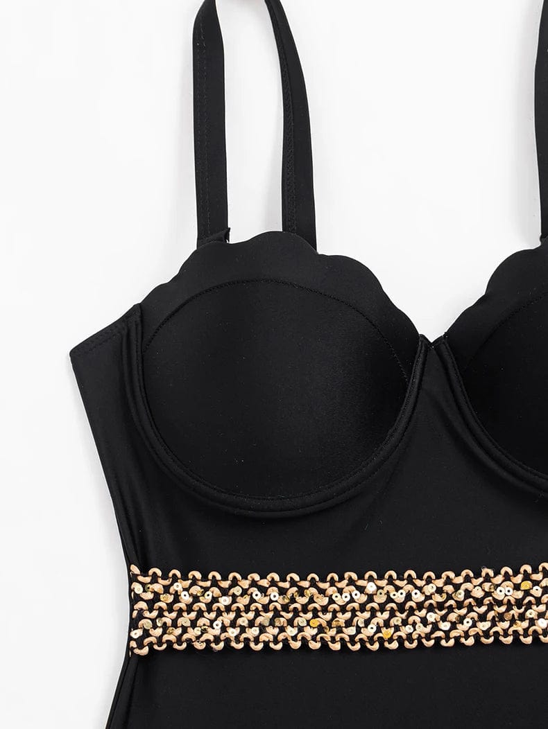Maillot de bain une pièce noir pour femme avec bretelles et détails dorés élégants.