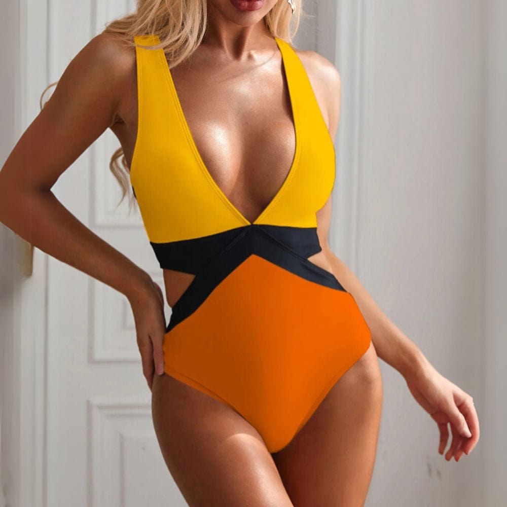 Maillot de bain une pièce femme échancré, design chic aux couleurs vives orange et jaune.