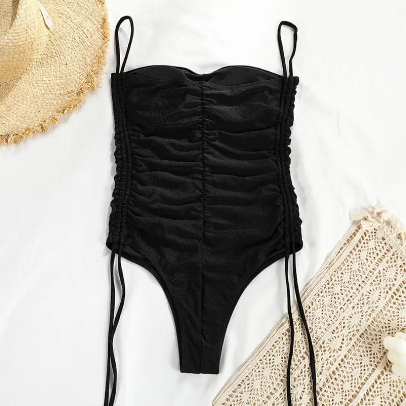 Maillot de bain une pièce noir pour femme avec bretelles fines, parfait pour un look estival chic.